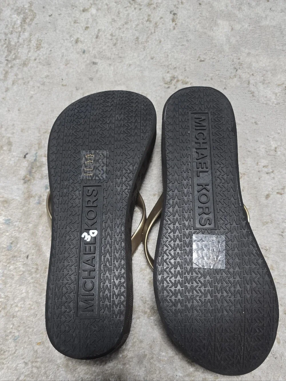 NWOT Michael Kors Black Footbed Flip Flops with Gold Straps